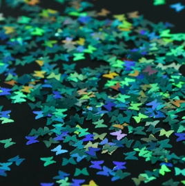 Paillettes papillon holographiques vert turquoise, gros plan