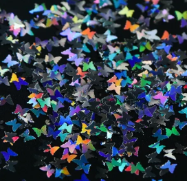 Paillettes papillon holographiques argentées, gros plan