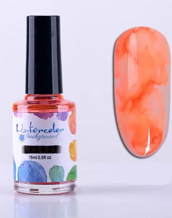 Flacon d'encre aquarelle orange 15 ml et son effet marbré sur un ongle