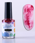Flacon d'encre aquarelle framboise 15 ml et son effet marbré sur un ongle