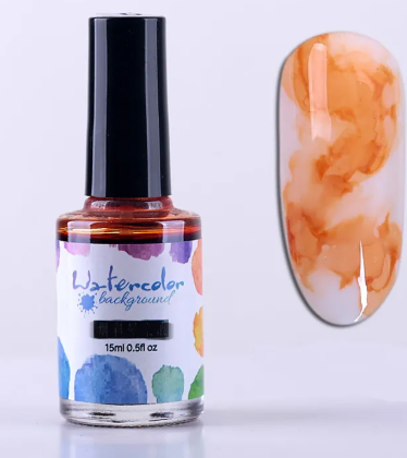 Flacon d'encre aquarelle orange brûlé 15 ml et son effet marbré sur un ongle