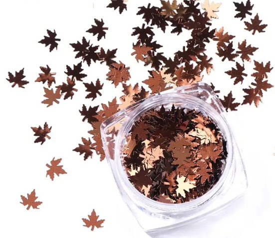 Pot de paillettes feuille d'érable rose gold cuivré et feuilles éparpillées